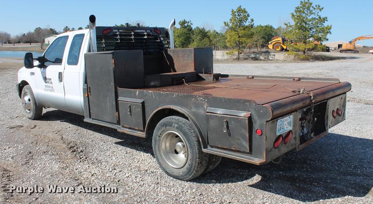 image for item DB5144 1999 Ford F350 Super Duty XLT SuperCab flatbed pickup truck