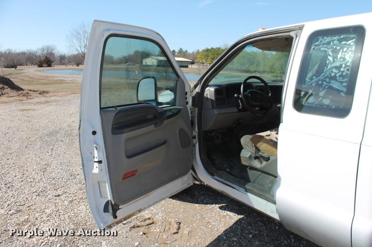 image for item DB5144 1999 Ford F350 Super Duty XLT SuperCab flatbed pickup truck