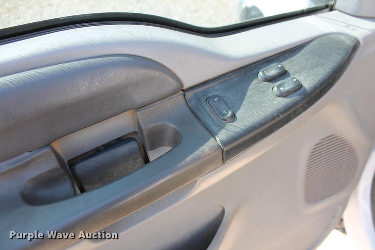 image for item DB5144 1999 Ford F350 Super Duty XLT SuperCab flatbed pickup truck