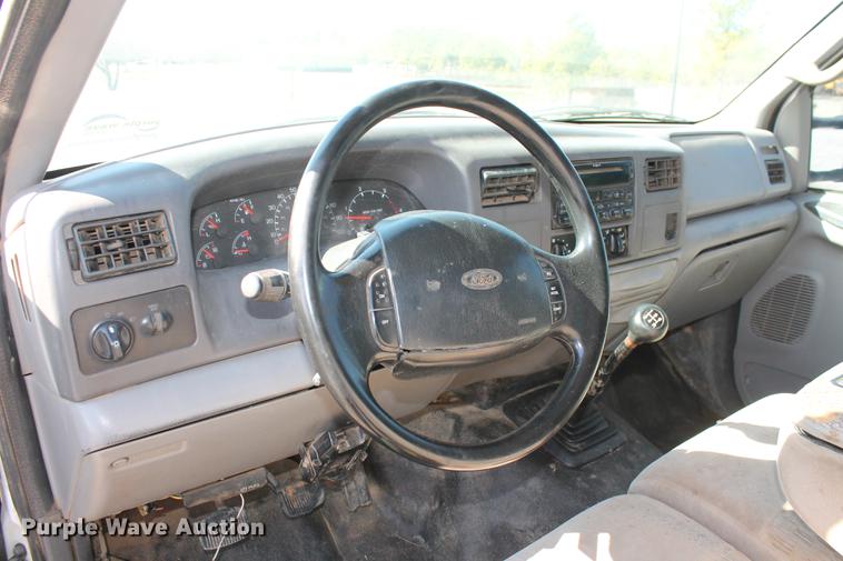 image for item DB5144 1999 Ford F350 Super Duty XLT SuperCab flatbed pickup truck