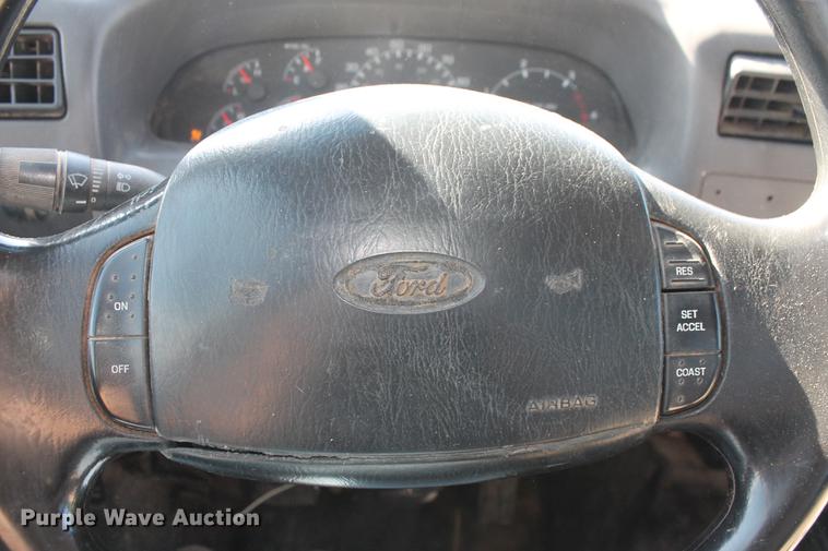 image for item DB5144 1999 Ford F350 Super Duty XLT SuperCab flatbed pickup truck