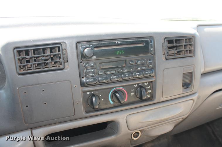 image for item DB5144 1999 Ford F350 Super Duty XLT SuperCab flatbed pickup truck