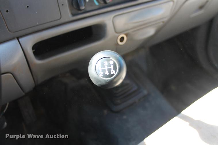 image for item DB5144 1999 Ford F350 Super Duty XLT SuperCab flatbed pickup truck