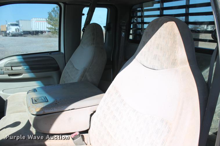 image for item DB5144 1999 Ford F350 Super Duty XLT SuperCab flatbed pickup truck