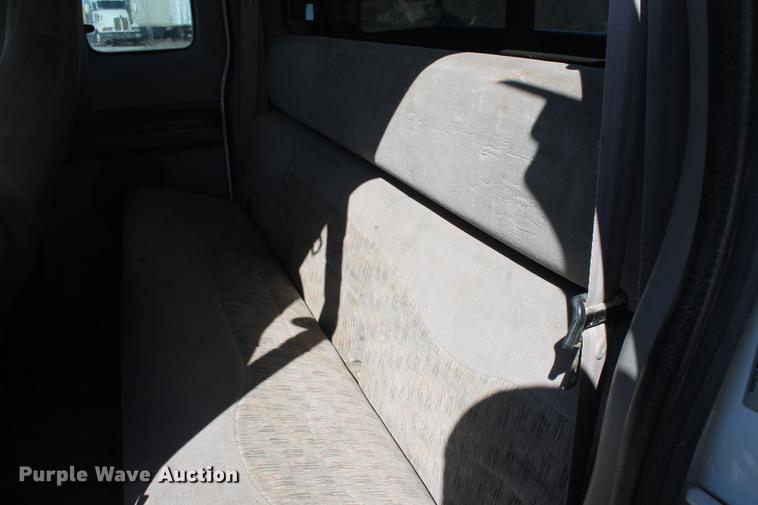 image for item DB5144 1999 Ford F350 Super Duty XLT SuperCab flatbed pickup truck