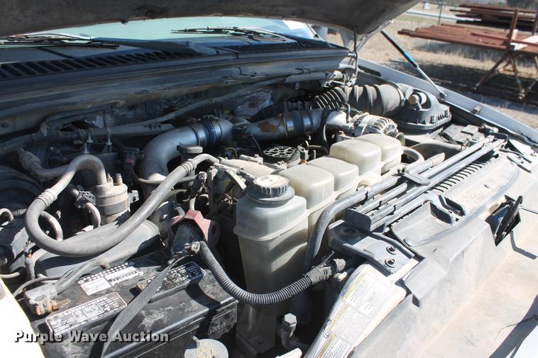 image for item DB5144 1999 Ford F350 Super Duty XLT SuperCab flatbed pickup truck