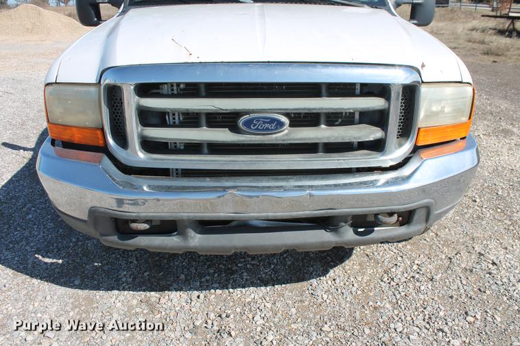 image for item DB5144 1999 Ford F350 Super Duty XLT SuperCab flatbed pickup truck