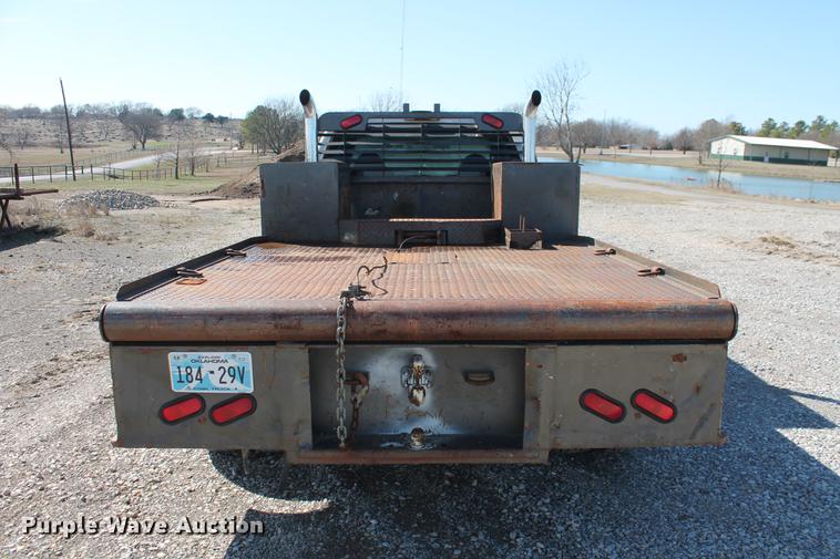 image for item DB5144 1999 Ford F350 Super Duty XLT SuperCab flatbed pickup truck