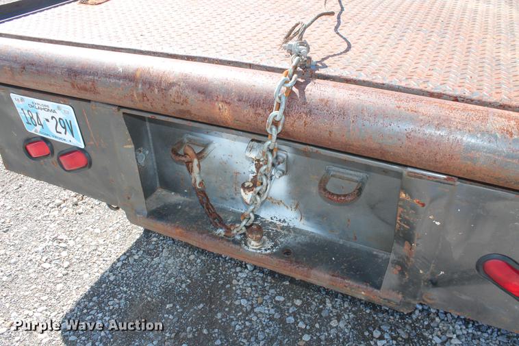 image for item DB5144 1999 Ford F350 Super Duty XLT SuperCab flatbed pickup truck