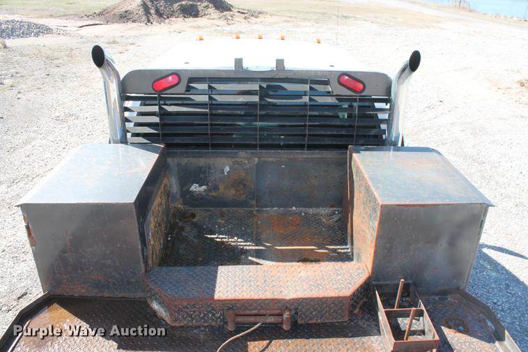 image for item DB5144 1999 Ford F350 Super Duty XLT SuperCab flatbed pickup truck