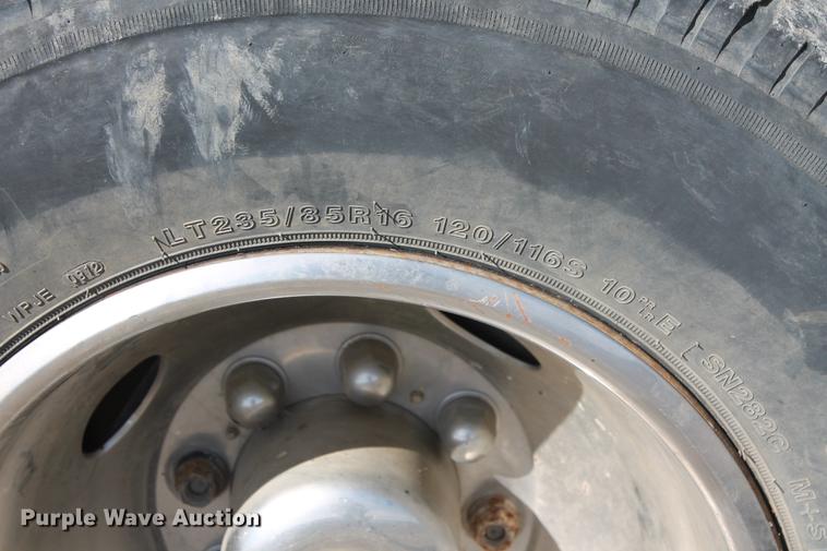 image for item DB5144 1999 Ford F350 Super Duty XLT SuperCab flatbed pickup truck