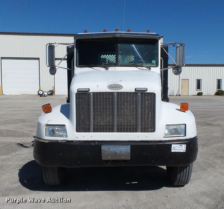 image for item DB7199 1997 Peterbilt 330 flatbed truck with mixing system