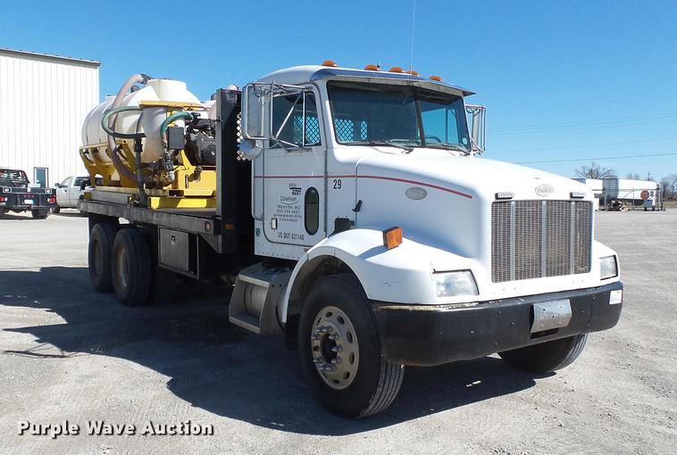 image for item DB7199 1997 Peterbilt 330 flatbed truck with mixing system