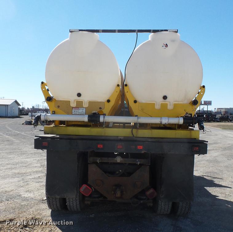 image for item DB7199 1997 Peterbilt 330 flatbed truck with mixing system