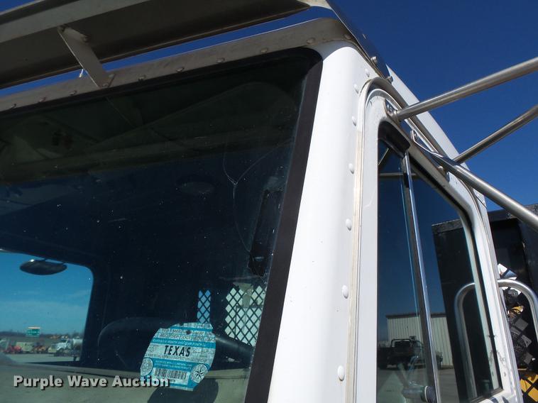 image for item DB7199 1997 Peterbilt 330 flatbed truck with mixing system