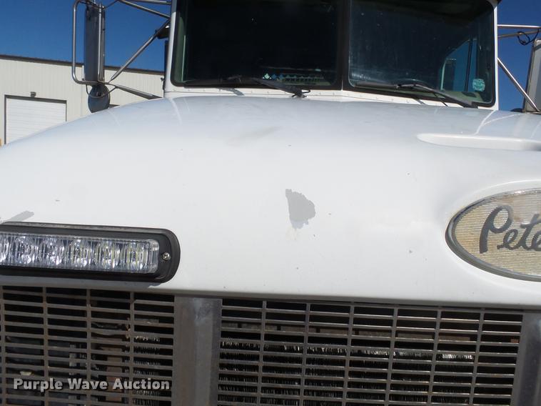 image for item DB7199 1997 Peterbilt 330 flatbed truck with mixing system