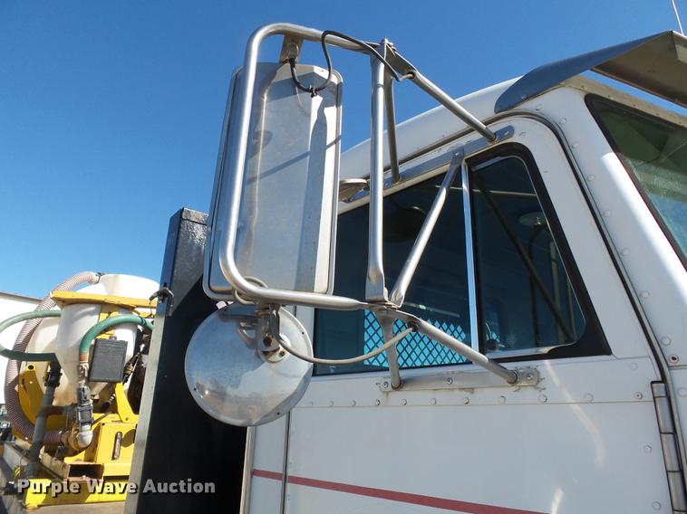 image for item DB7199 1997 Peterbilt 330 flatbed truck with mixing system