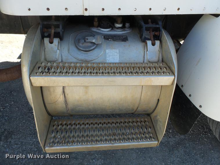 image for item DB7199 1997 Peterbilt 330 flatbed truck with mixing system