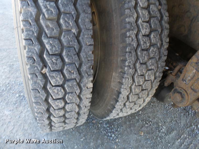 image for item DB7199 1997 Peterbilt 330 flatbed truck with mixing system