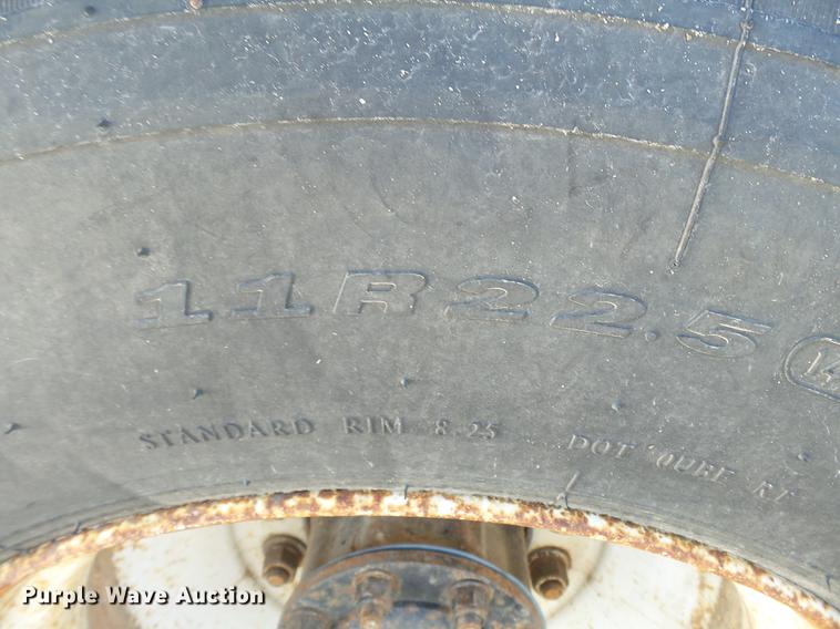 image for item DB7199 1997 Peterbilt 330 flatbed truck with mixing system