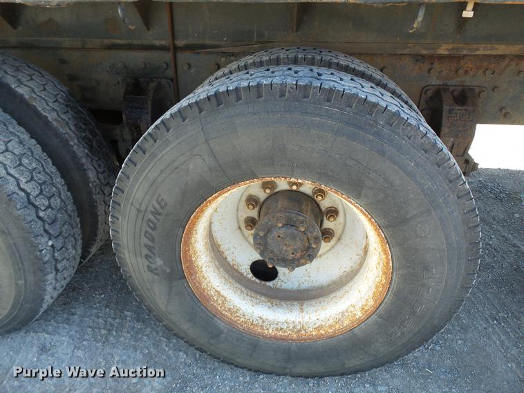 image for item DB7199 1997 Peterbilt 330 flatbed truck with mixing system