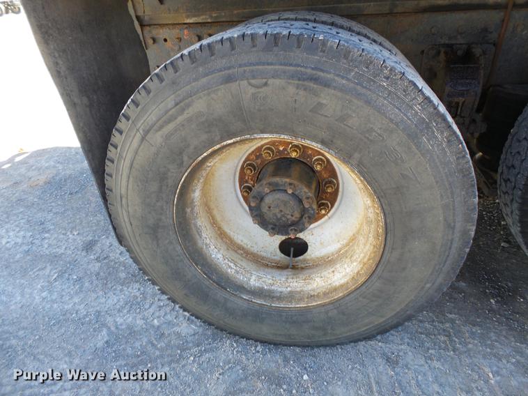 image for item DB7199 1997 Peterbilt 330 flatbed truck with mixing system