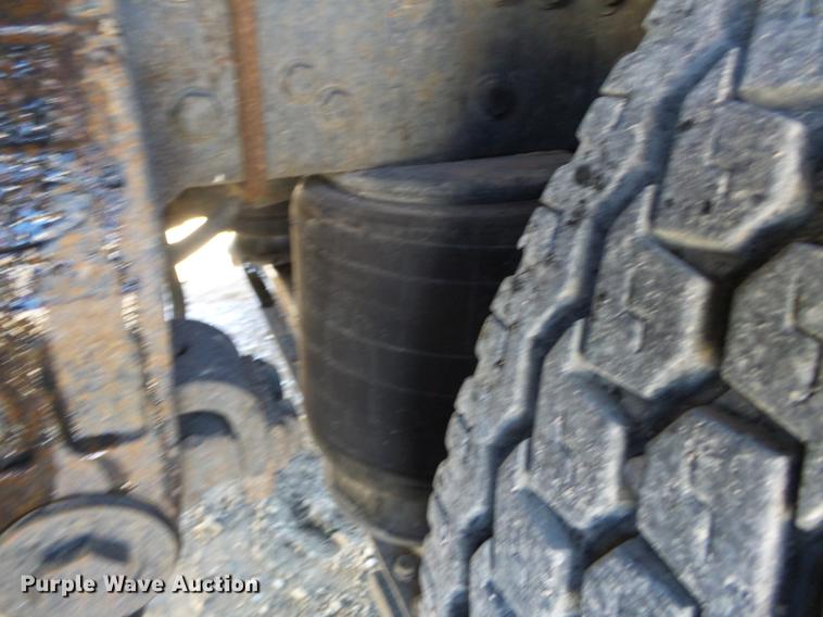 image for item DB7199 1997 Peterbilt 330 flatbed truck with mixing system