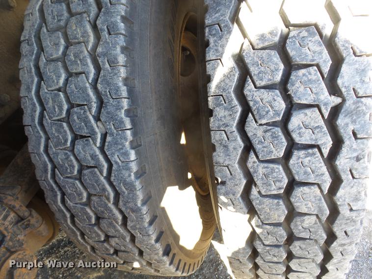 image for item DB7199 1997 Peterbilt 330 flatbed truck with mixing system