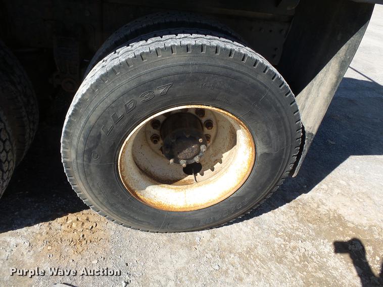 image for item DB7199 1997 Peterbilt 330 flatbed truck with mixing system