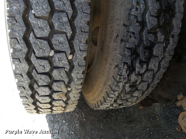 image for item DB7199 1997 Peterbilt 330 flatbed truck with mixing system