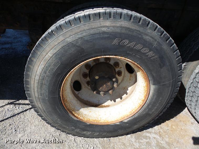 image for item DB7199 1997 Peterbilt 330 flatbed truck with mixing system