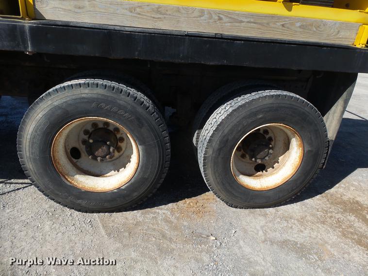 image for item DB7199 1997 Peterbilt 330 flatbed truck with mixing system