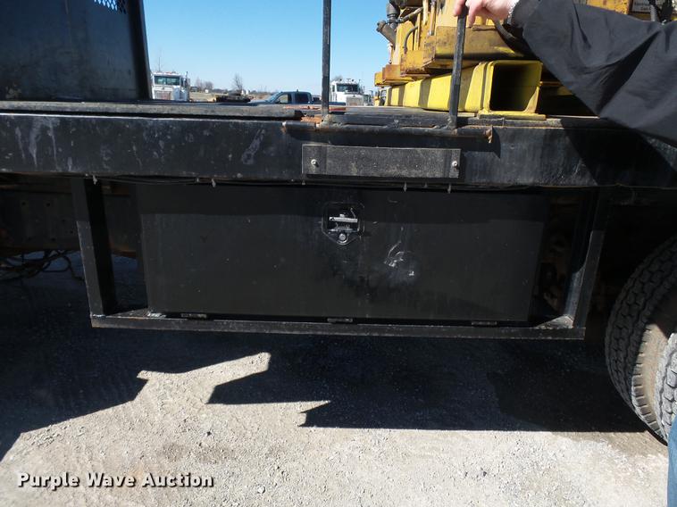 image for item DB7199 1997 Peterbilt 330 flatbed truck with mixing system