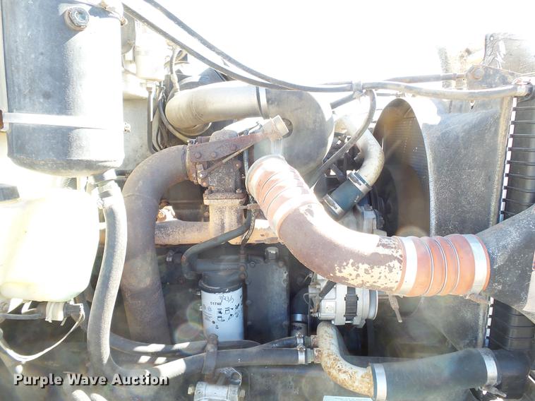 image for item DB7199 1997 Peterbilt 330 flatbed truck with mixing system