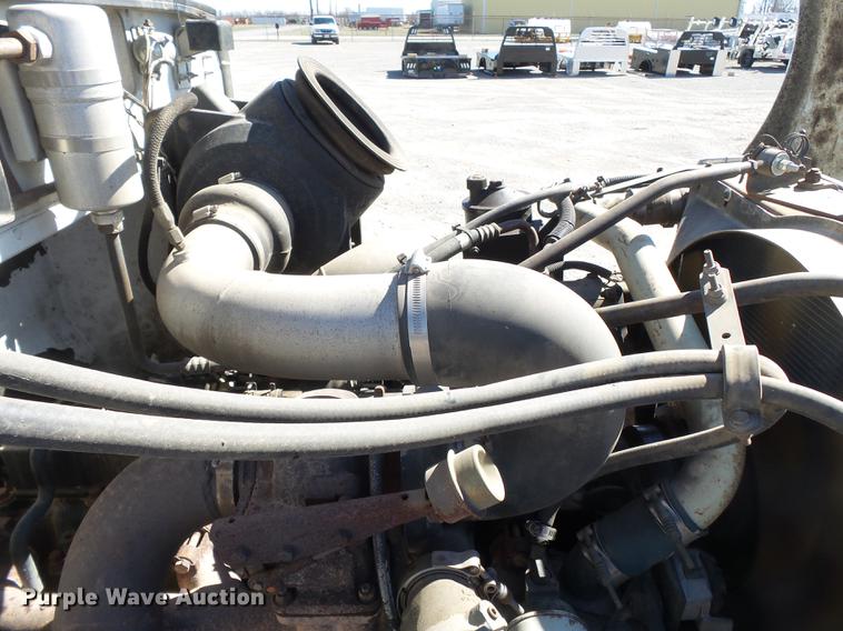 image for item DB7199 1997 Peterbilt 330 flatbed truck with mixing system