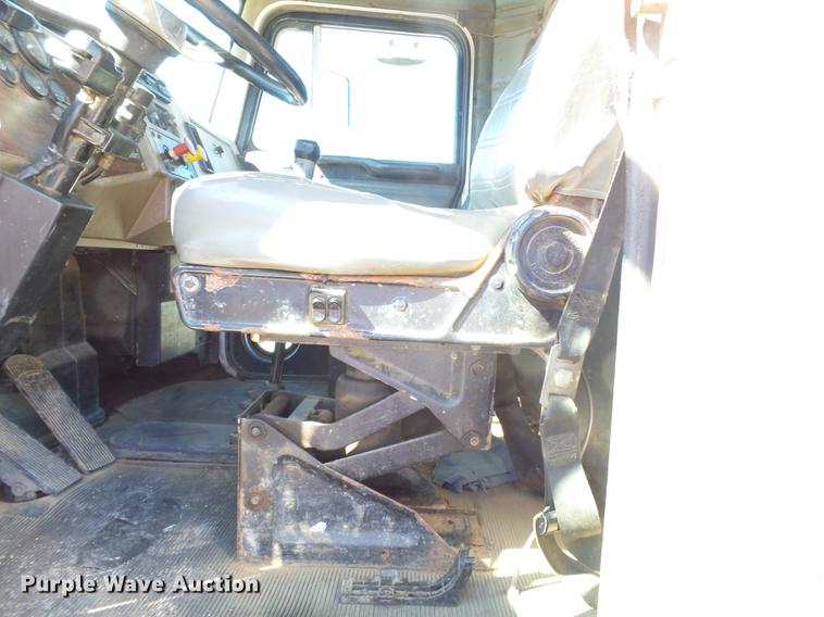 image for item DB7199 1997 Peterbilt 330 flatbed truck with mixing system