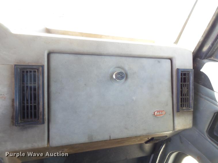 image for item DB7199 1997 Peterbilt 330 flatbed truck with mixing system