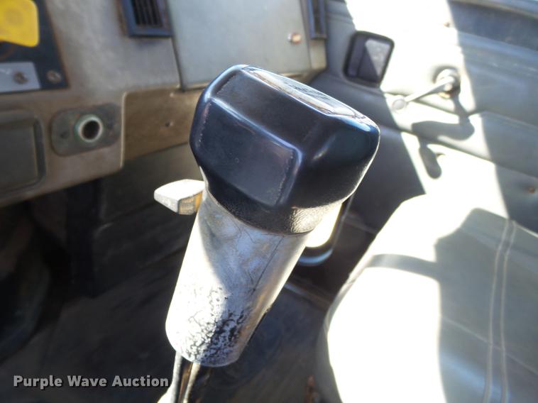 image for item DB7199 1997 Peterbilt 330 flatbed truck with mixing system