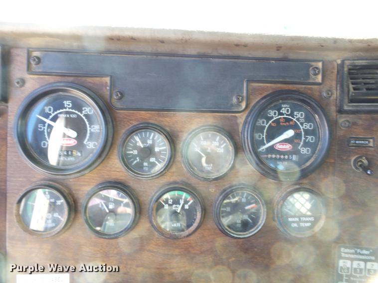 image for item DB7199 1997 Peterbilt 330 flatbed truck with mixing system