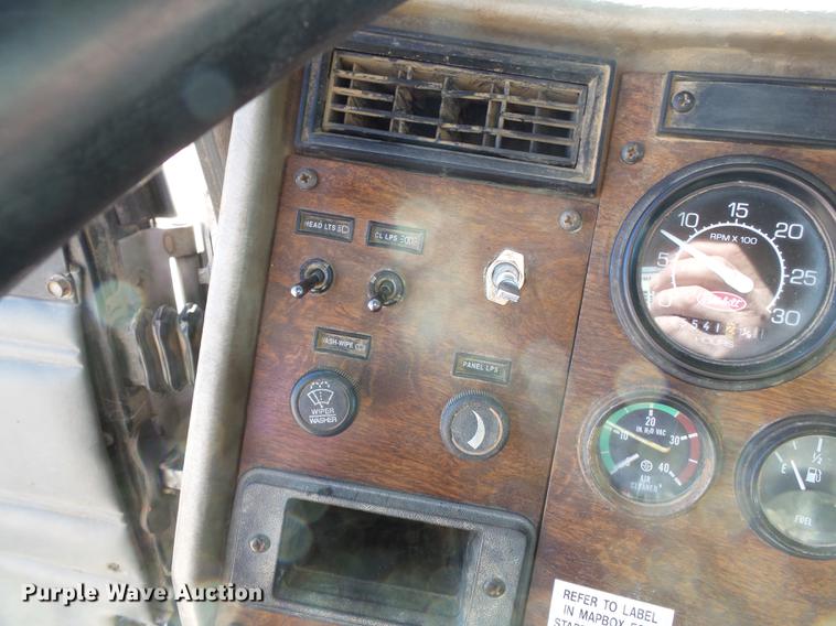 image for item DB7199 1997 Peterbilt 330 flatbed truck with mixing system