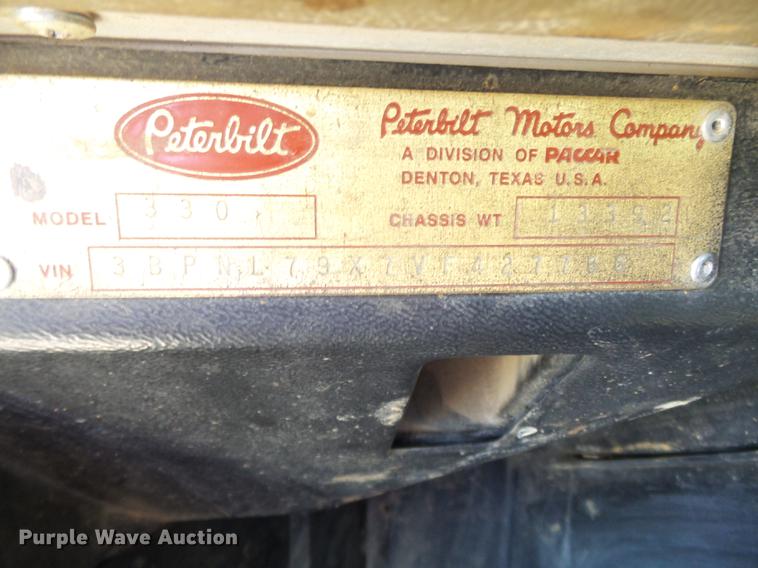 image for item DB7199 1997 Peterbilt 330 flatbed truck with mixing system