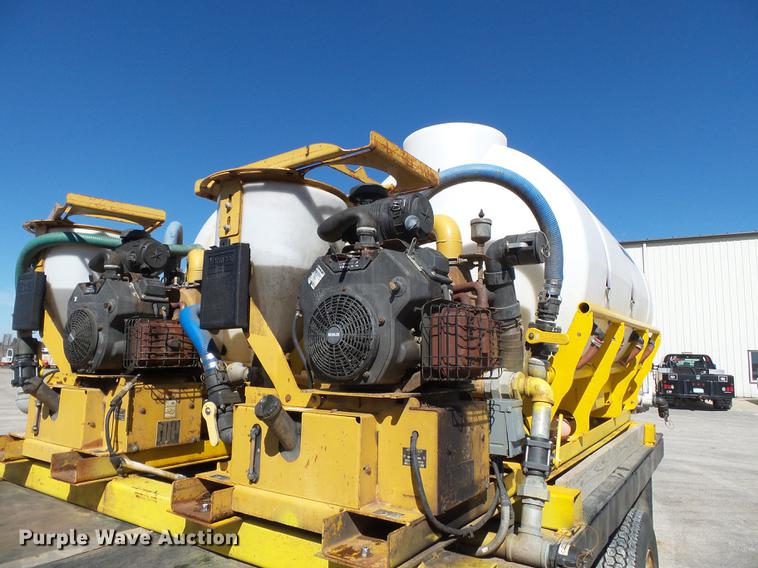 image for item DB7199 1997 Peterbilt 330 flatbed truck with mixing system