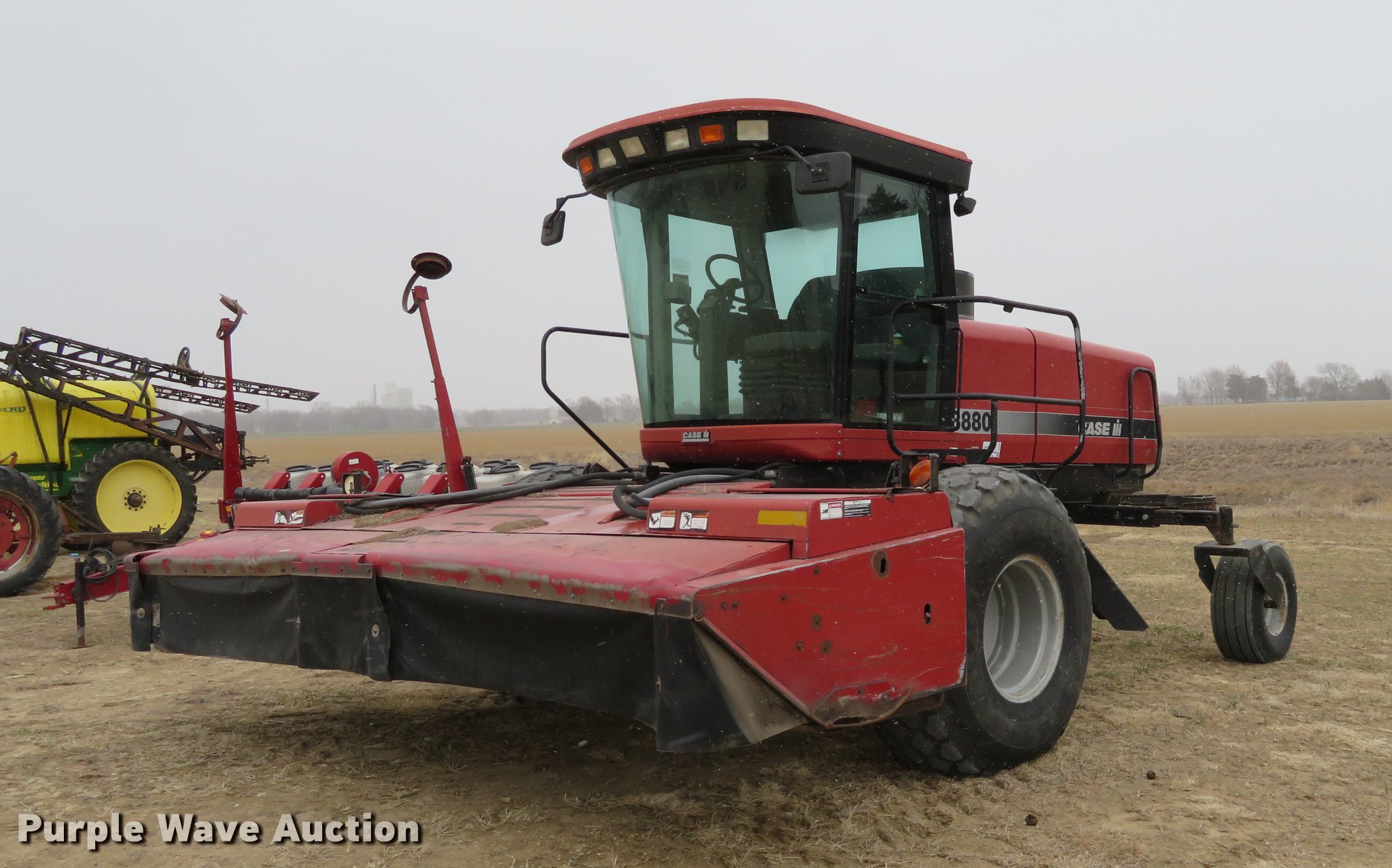 1999 Case IH 8880 windrower in Abilene, KS Item DC0894 sold Purple Wave