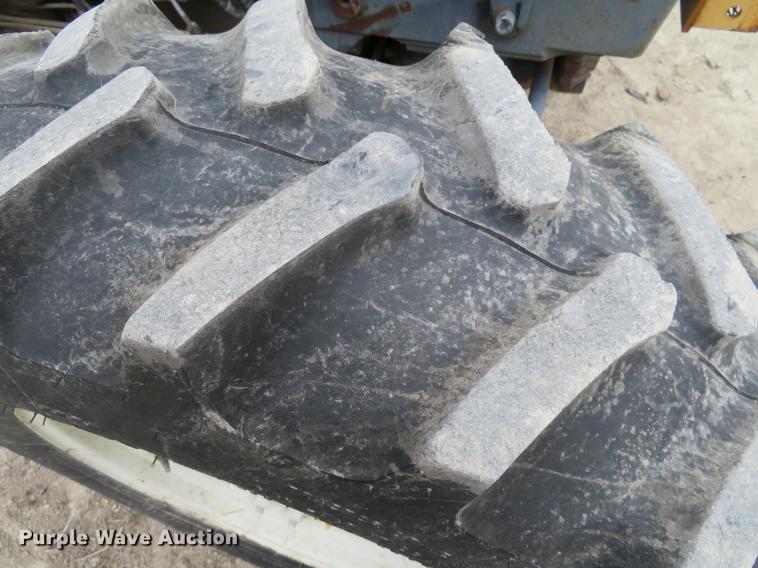 image for item DC0902 2000 New Holland TS110 MFWD tractor