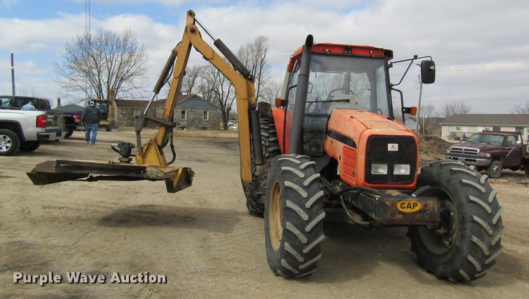 image for item DC4427 AGCO RT95 MFWD tractor with side boom mower