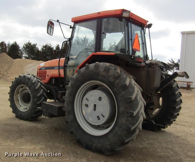 image for item DC4427 AGCO RT95 MFWD tractor with side boom mower