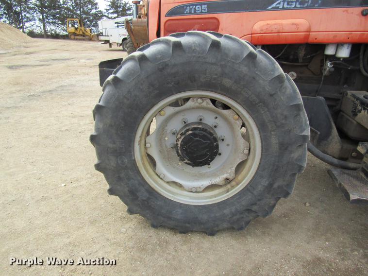 image for item DC4427 AGCO RT95 MFWD tractor with side boom mower