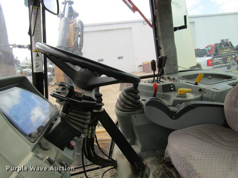 image for item DC4427 AGCO RT95 MFWD tractor with side boom mower