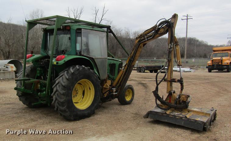 image for item DC4430 2002 John Deere 6420 tractor with side boom mower