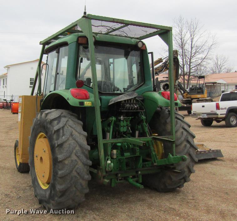 image for item DC4430 2002 John Deere 6420 tractor with side boom mower